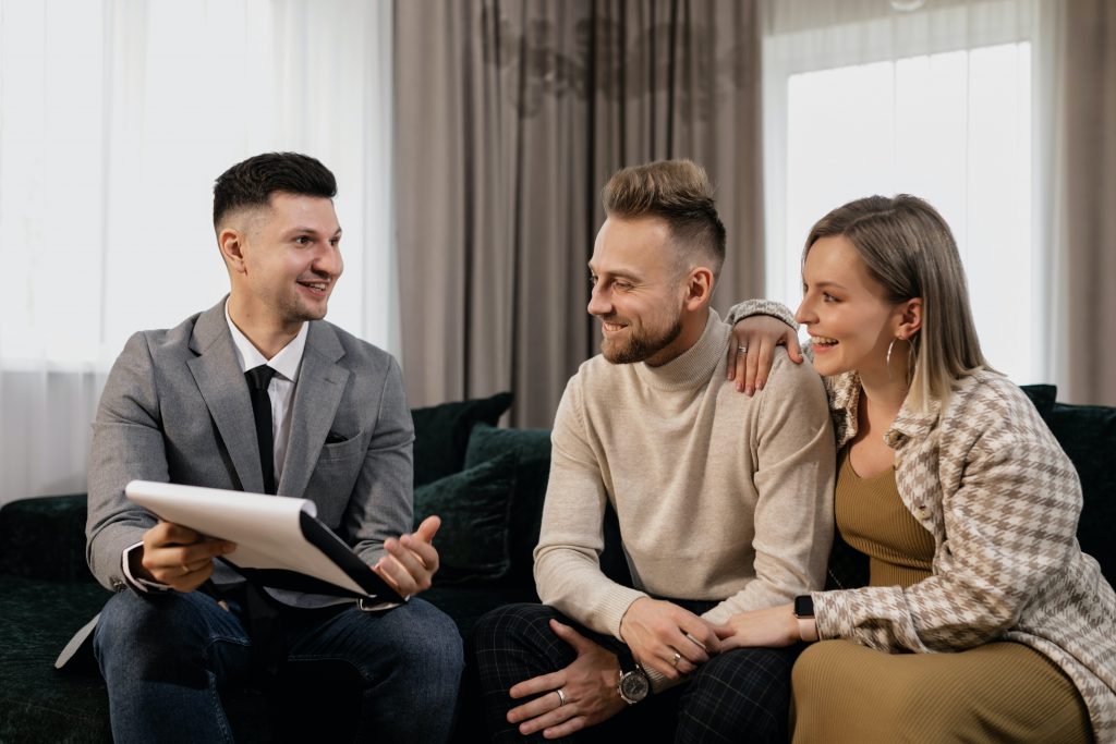 couple meeting with real estate agent
